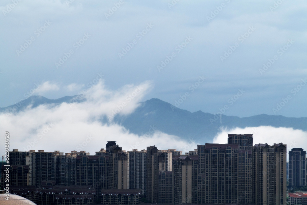 City apartment buildings in the morning fog