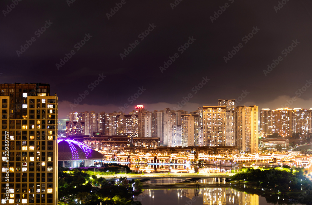 Fototapeta premium Modern city buildings at night