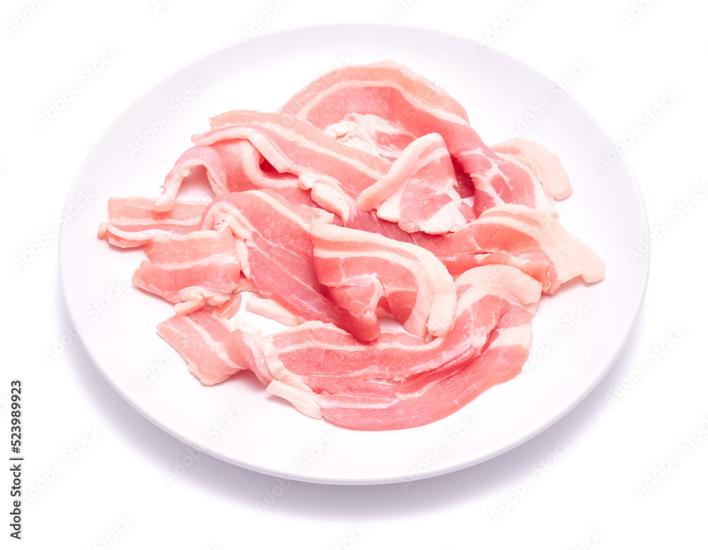 Bacon strips on ceramic plate isolated on white background Bacon strips on ceramic plate isolated on white background