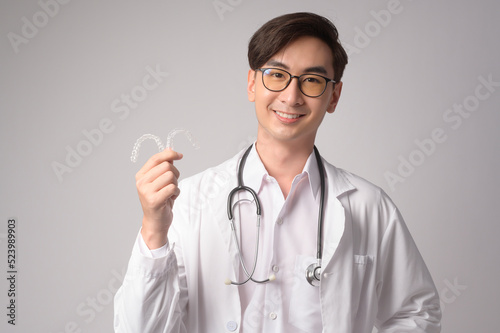 Portrait of male confident doctor over white background studio  healthcare and Medical technology concept.