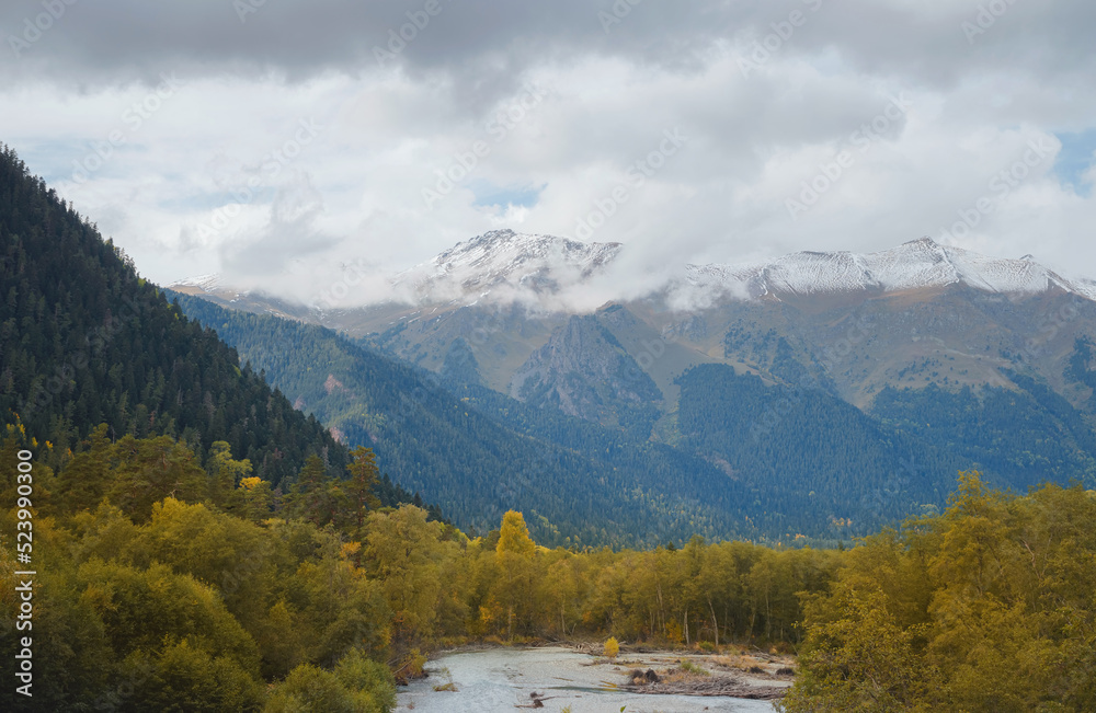trip to Caucasus mountains, Arkhyz, Teberdinsky reserve. concept of discovery and exploration of wild places in early autumn. view from forest to river