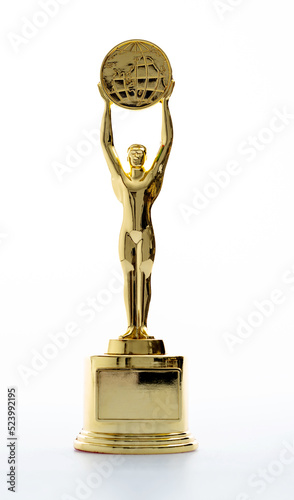 Golden statuette of a man on white background