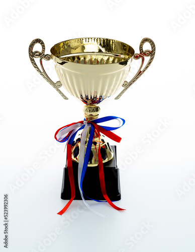 Golden trophy with ribbon on white background