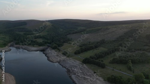 Aerial drone flight over and around Errwood Reservior in Goyt Valley Buxton UK showing very low water levels during the heatwave 2022 photo