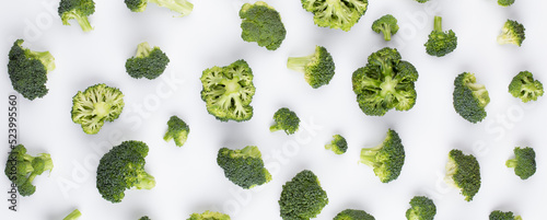 Broccoli pattern isolated on a white background. Various multiple parts of broccoli flower. Top view.