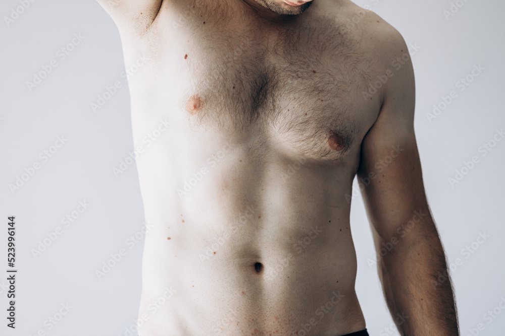 Naklejka premium Handsome guy with abs standing without clothes