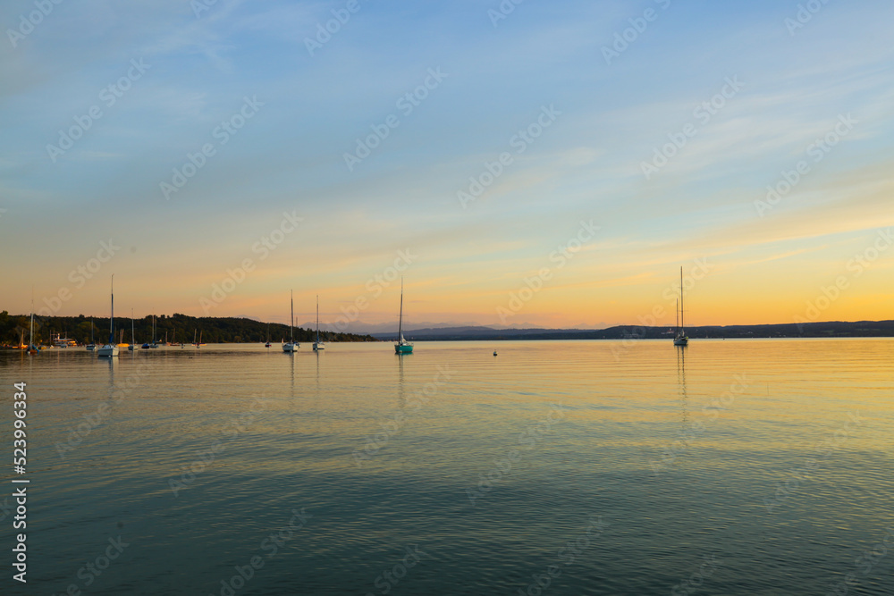 Sailing boats on the Ammersee in the sunset
