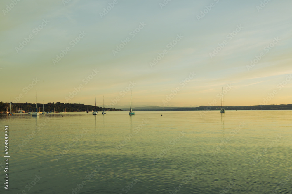 Sailing boats on the Ammersee in the sunset