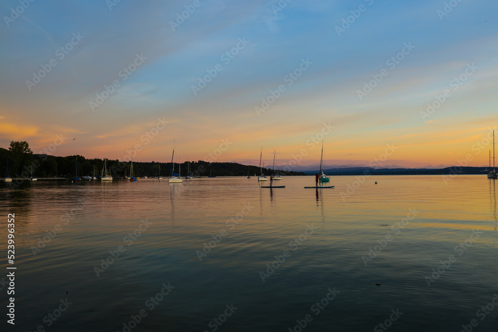 Standup Paddler in the sunset at the Ammersee