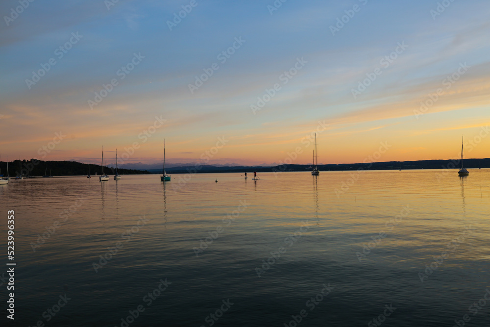 Standup Paddler in the sunset at the Ammersee