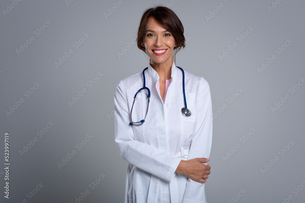 Studio portrait of middle aged female doctor Studio portrait of middle aged female doctor