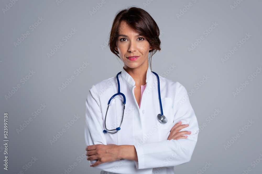 Studio portrait of middle aged female doctor Studio portrait of middle aged female doctor
