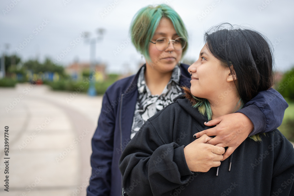 Fototapeta premium Lesbian couple embracing each other tenderly