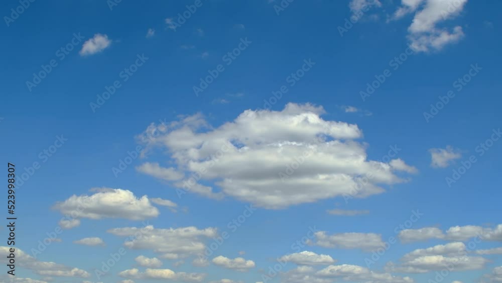 Sky in calm weather. Still clouds changing shape in the blue sky. Sky in calm weather. Still clouds changing shape in the blue sky.