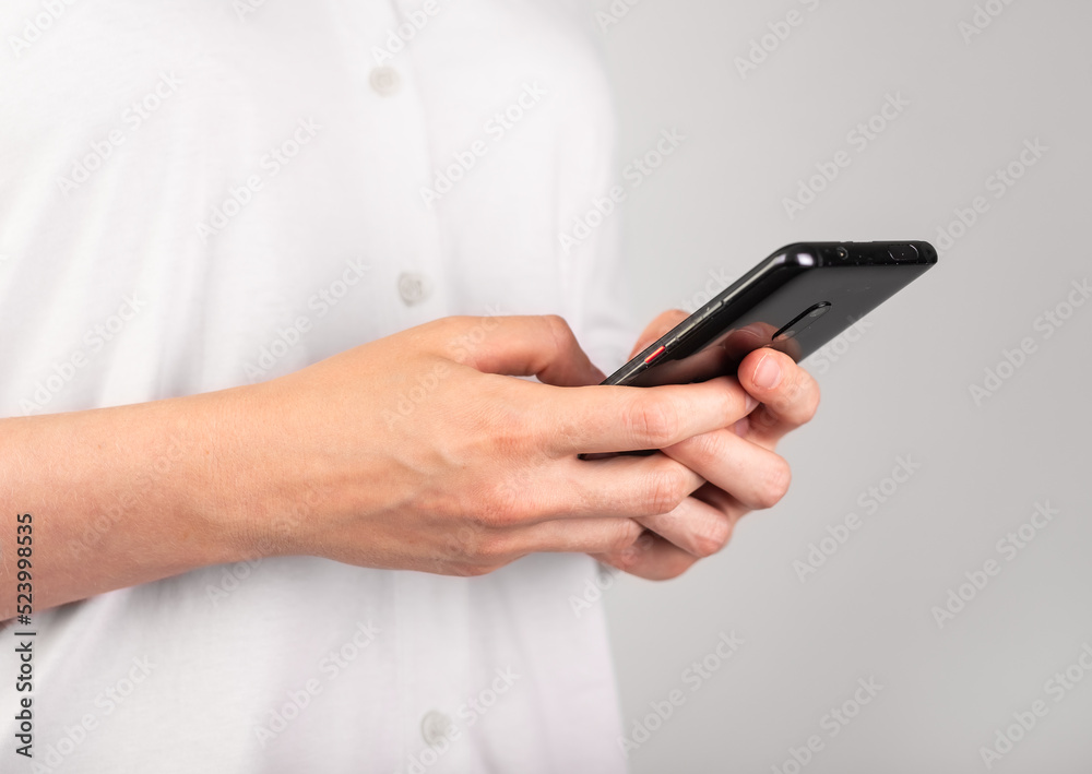 Woman hands texting message at phone. Female using messenger at Android for chatting or surfing Internet. Modern lifestyle with telephone concept. Profile view. High quality photo Woman hands texting message at phone. Female using messenger at Android for chatting or surfing Internet. Modern lifestyle with telephone concept. Profile view. High quality photo