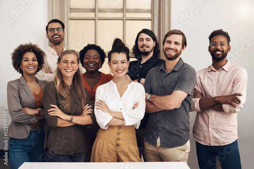 Happy, diverse and smiling startup entrepreneurs standing together showing teamwork goals. Contact us and learn about us and our vision, mission and faq from our international business community photo