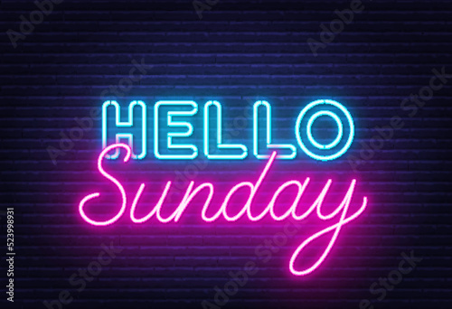 Hello Sunday sign on brick wall background.