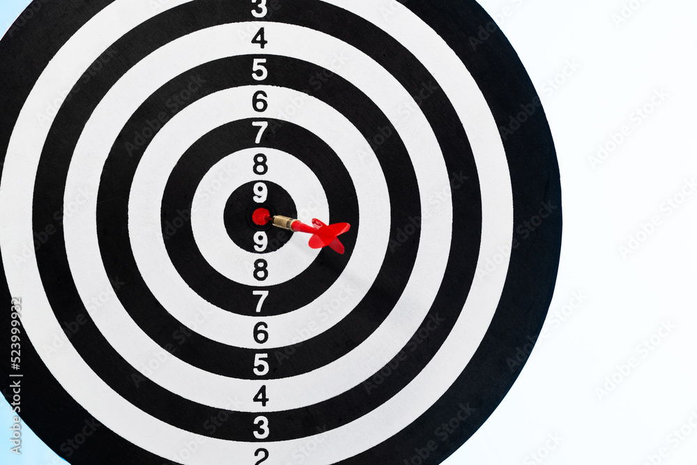 Dart hitting on center target Dart hitting on center target