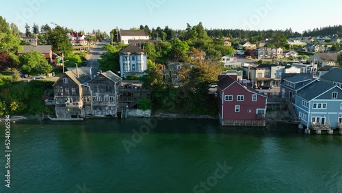 Aerial shot of worn down waterfront buildings in Coupeville, WA at sunset. photo