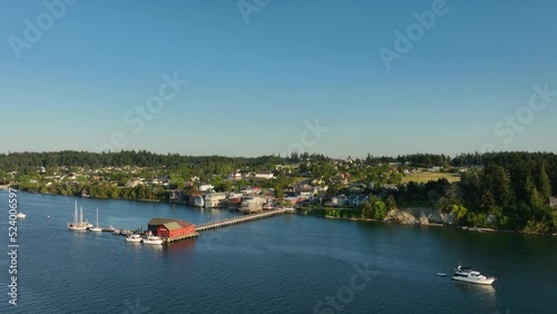 Wide aerial shot pulling away from Coupeville, WA out over the water. photo