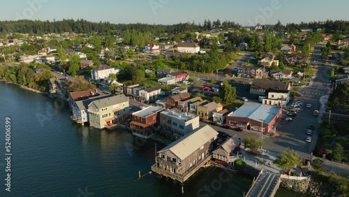 Drone shot pulling away from Coupeville's main street amenities to show the entirety of the city and the wharf. photo