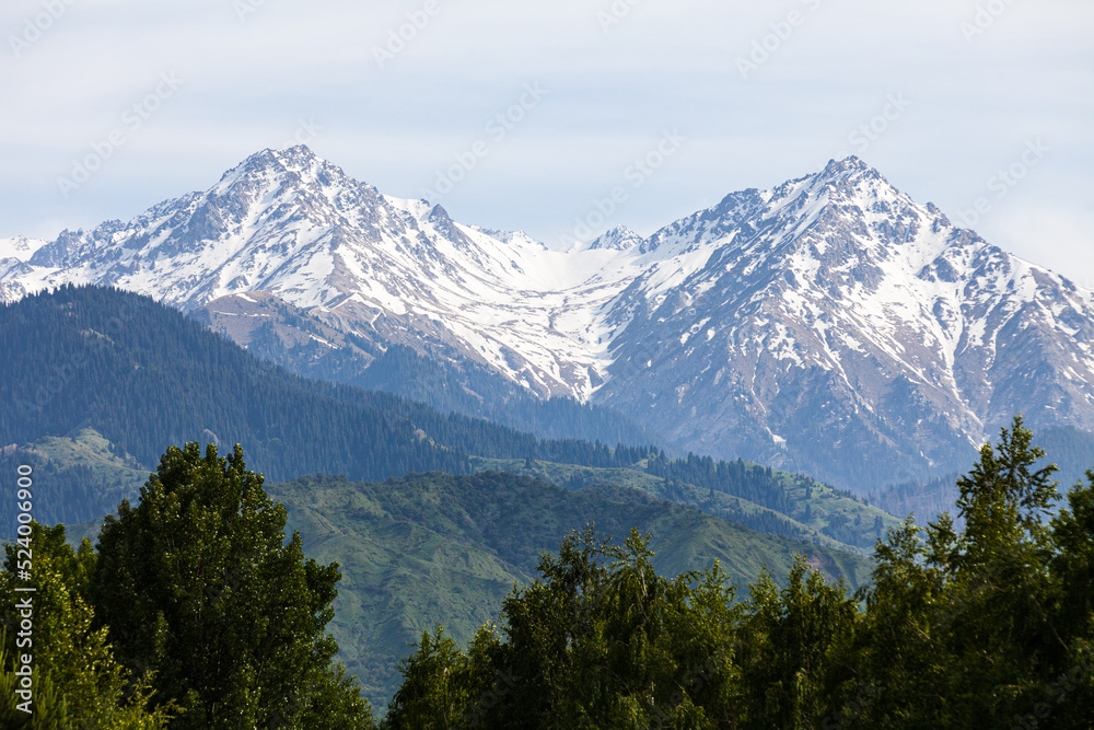 Magnificent snow-capped mountain peaks in the vicinity of Almaty
