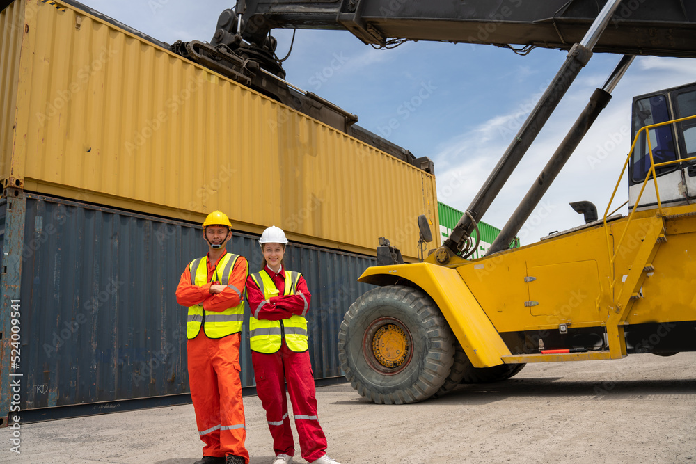 Woman Manager and forman smile and cross arm in front of Cargo forklift in warehouse , Manager use tablet in white helmet Safety Supervisor in Container Custom Terminal port concept import export v Woman Manager and forman smile and cross arm in front of Cargo forklift in warehouse , Manager use tablet in white helmet Safety Supervisor in Container Custom Terminal port concept import export v