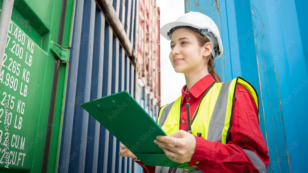 Woman inspector foreman Checking Cargo in Container cargo CustomTerminal port, Foerman use Clipboard paper for checking cargo concept import export transportation and logistic insurance service Woman inspector foreman Checking Cargo in Container cargo CustomTerminal port, Foerman use Clipboard paper for checking cargo concept import export transportation and logistic insurance service