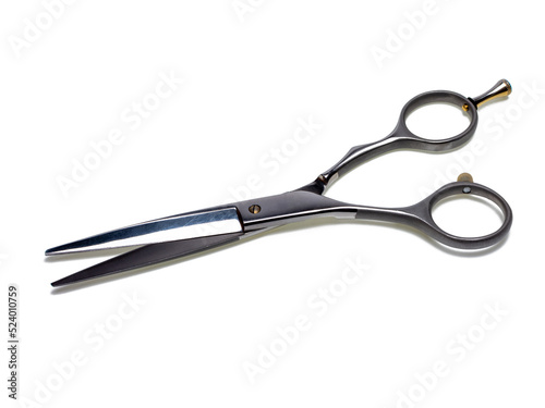 Professional hairdressing scissors  cutting tool. Close-up  isolated on white background