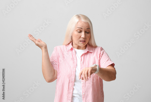 Confused mature woman with ...