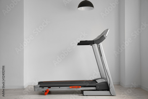 Modern treadmill and hangin...
