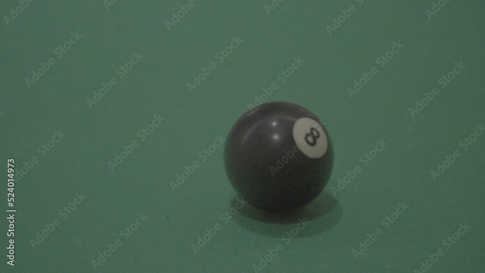billiard table with cue and ball
