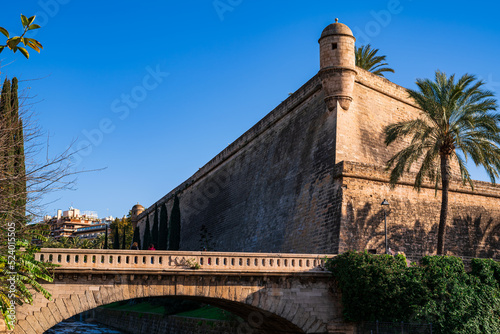The bastion of Sant Pere from the bridge where a river flows. Photography made in Mallorca, Balearic Islands, Spain.