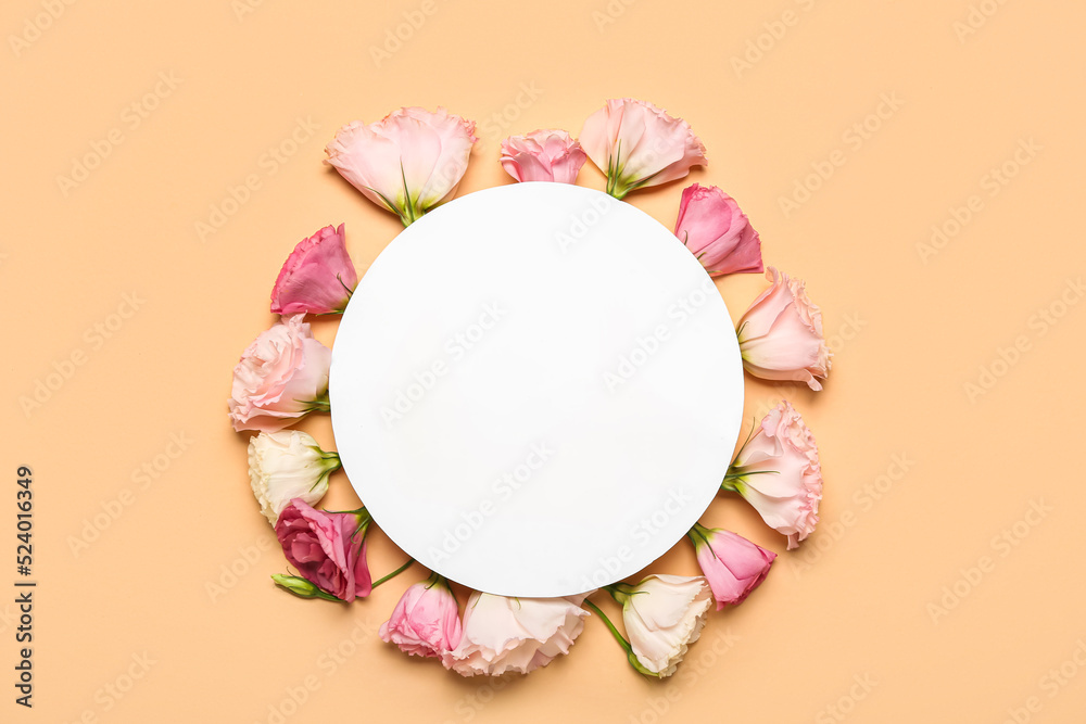 Blank paper sheet with pink flowers on beige background