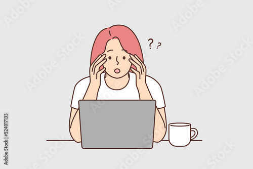 Confused woman look at screen shocked by news