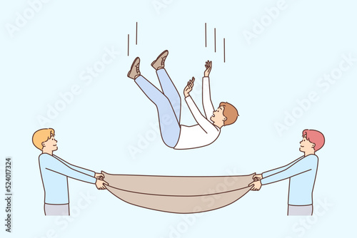 Men with cloth saving guy from falling