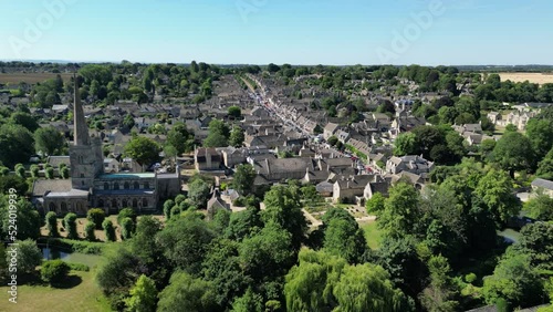 St. John the Baptist church Burford town in background Oxfordshire UK drone aerial view photo