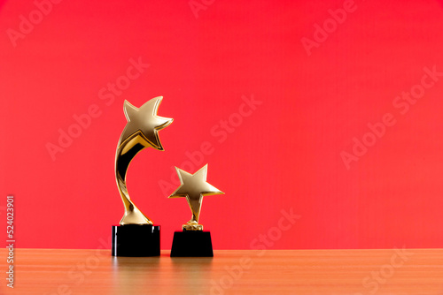 Obraz na plátně Golden star trophies on wooden table