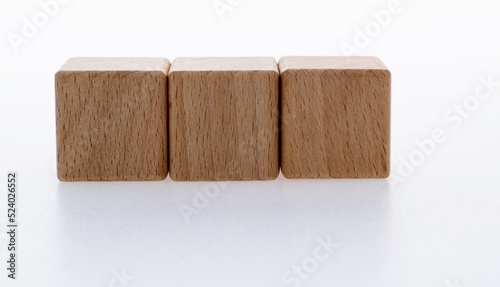 Three wooden blocks on white background