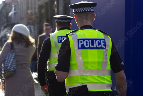 Police officer on duty on a city centre street during special event.  photo
