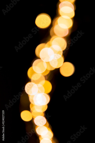 Blurred Gold Bokehs as a Background