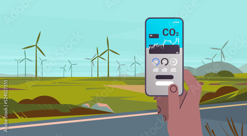 hand using carbon credits mobile app on smartphone screen responsibility of co2 emission environmental conservation