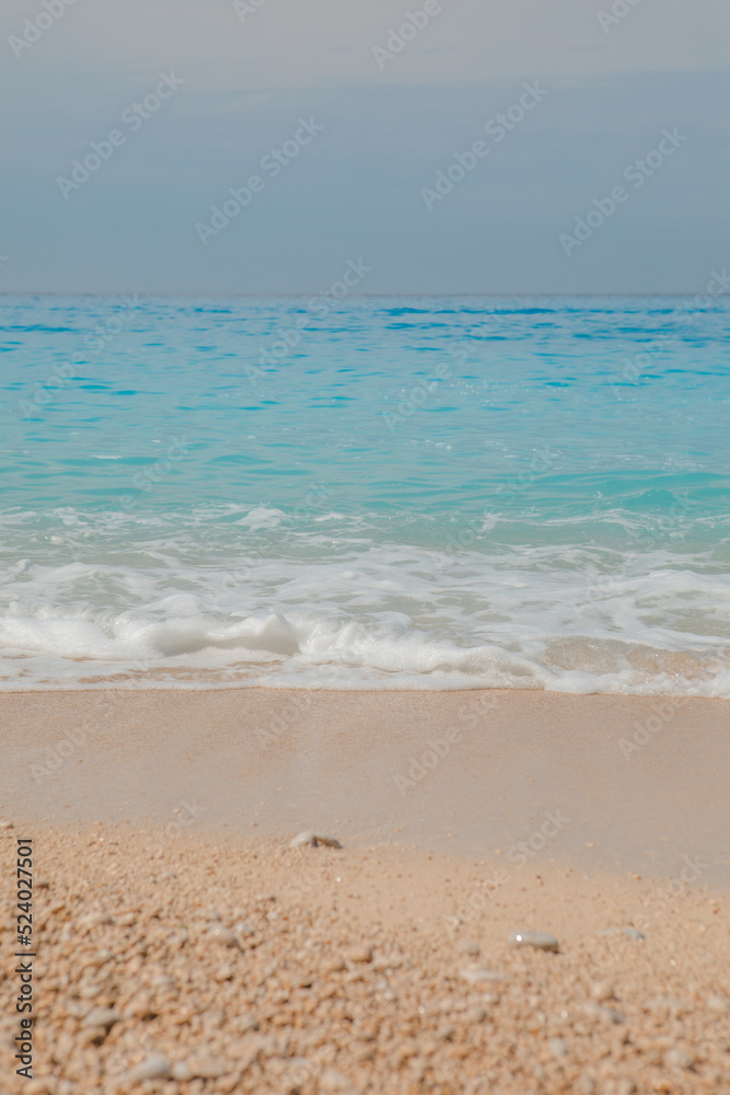sea beach with white rocks and blue water
