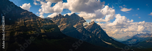 Mistaya Mountain and Mt. Patterson over Peyto Lake in Banff National  Park, Alberta, Canada. Dramatic cloudscape and majestic mountains in the Icefields Parkway regions. photo