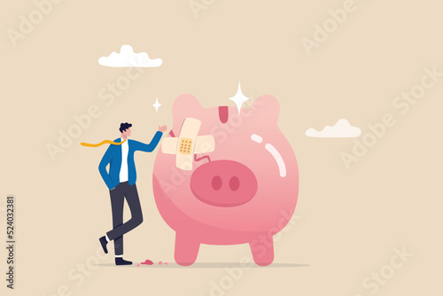 Fix financial problem, investment or saving impacted by crisis or inflation, bankruptcy, deposit or budget concept, poor cracked piggy bank with bandage metaphor of fixing problem.