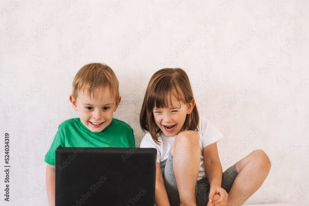 Smiling children learn online, play, have fun or chat with friends. Maybe they are looking for something interesting. Smiling children learn online, play, have fun or chat with friends. Maybe they are looking for something interesting.