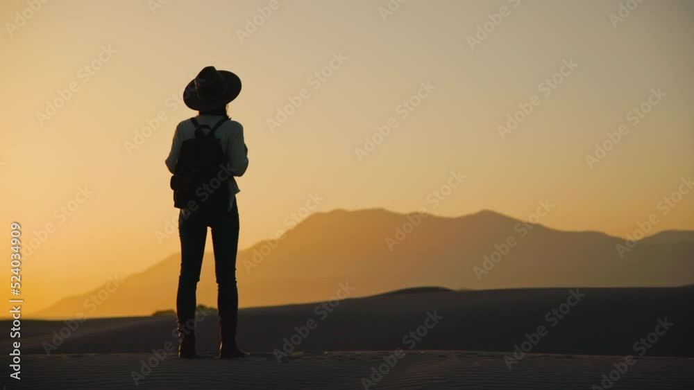 Traveling girl with a backpack on the background of nature at sunset Traveling girl with a backpack on the background of nature at sunset