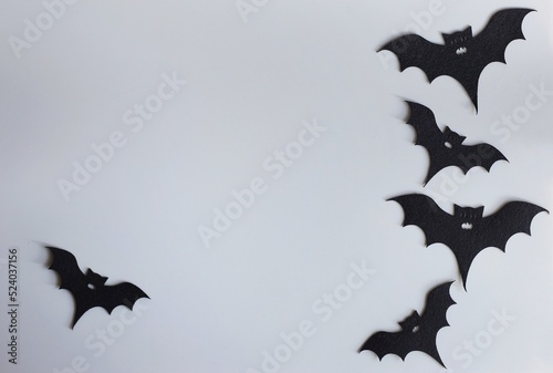 Five silhouettes of bats on a gray background. Creative halloween concept backdrop. halloween bats craft.