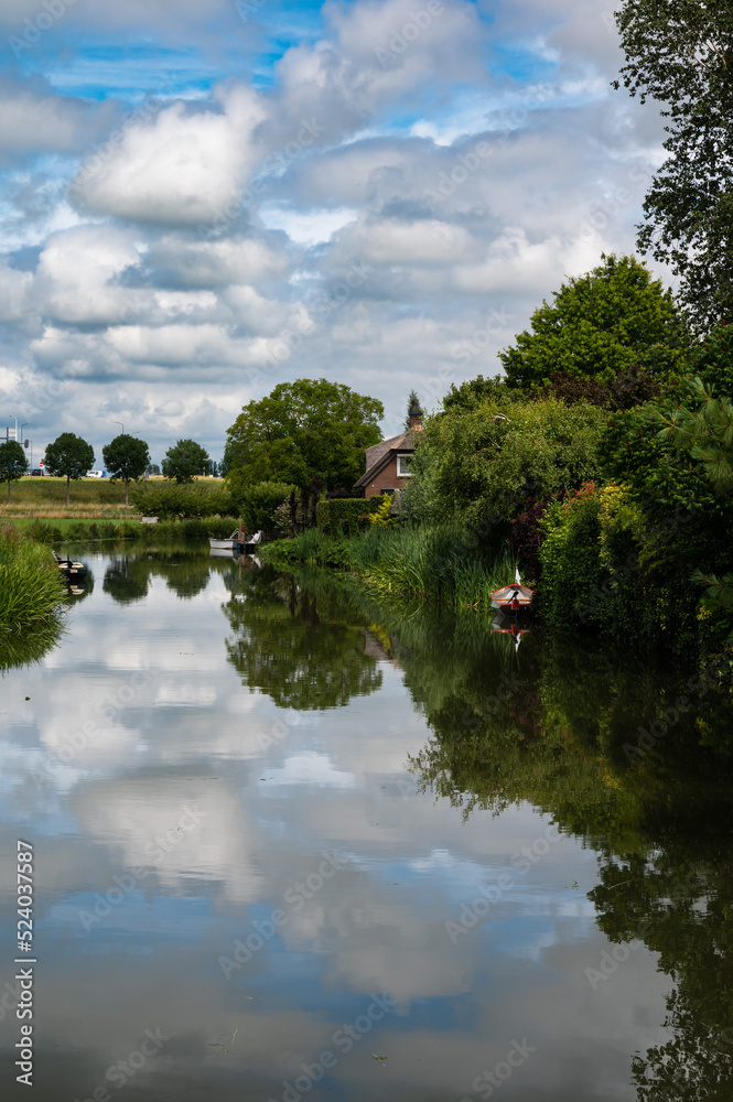 Tiel, Gelderland, The Netherlands, Reflecting nature in the water of the River Ligne Tiel, Gelderland, The Netherlands, Reflecting nature in the water of the River Ligne