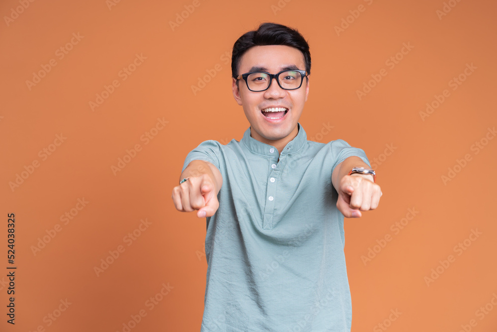 Photo of young Asian man on background Photo of young Asian man on background